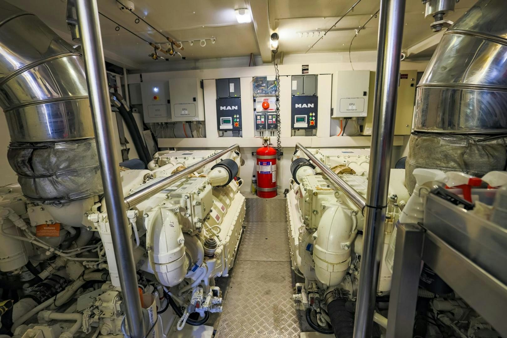 a room with machinery and pipes aboard HAPPY HOURS Yacht for Sale