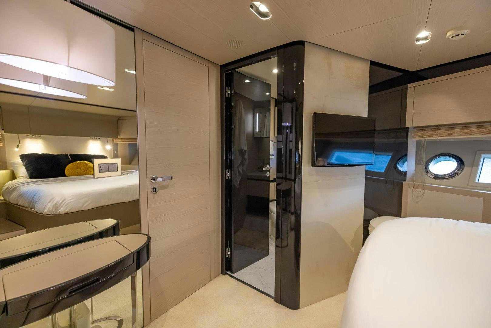 a room with a bed and a closet aboard HAPPY HOURS Yacht for Sale