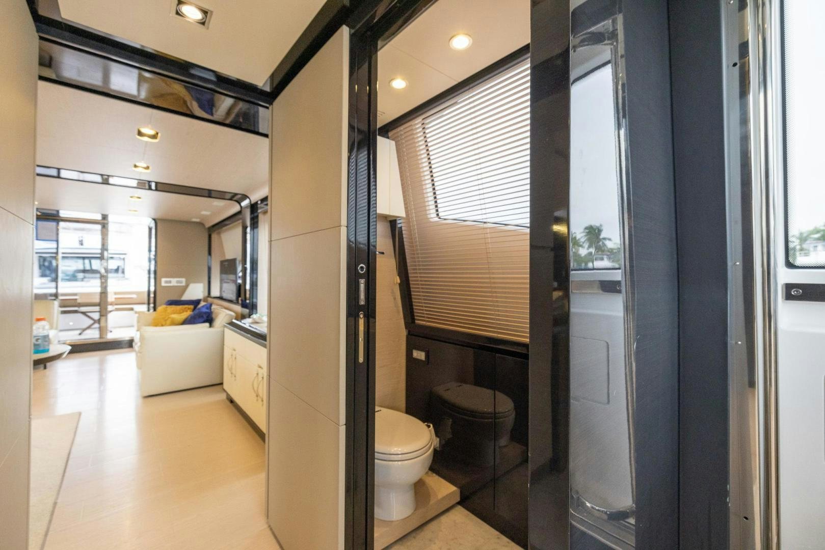 a bathroom with a glass shower aboard HAPPY HOURS Yacht for Sale