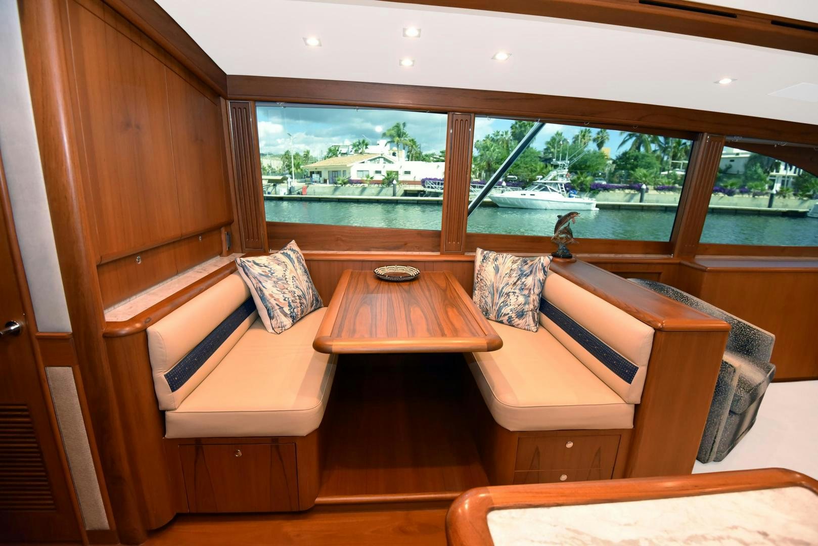 a room with a bench and a table aboard MY LYNN Yacht for Sale