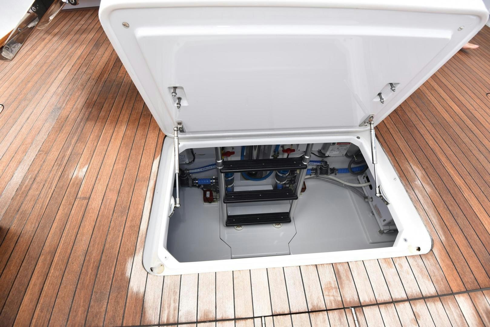 a white rectangular object on a wooden surface aboard MY LYNN Yacht for Sale