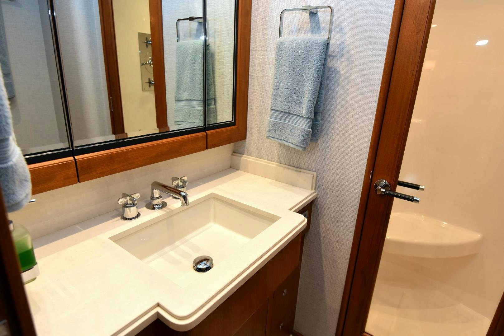 a bathroom with a sink and a mirror aboard MY LYNN Yacht for Sale