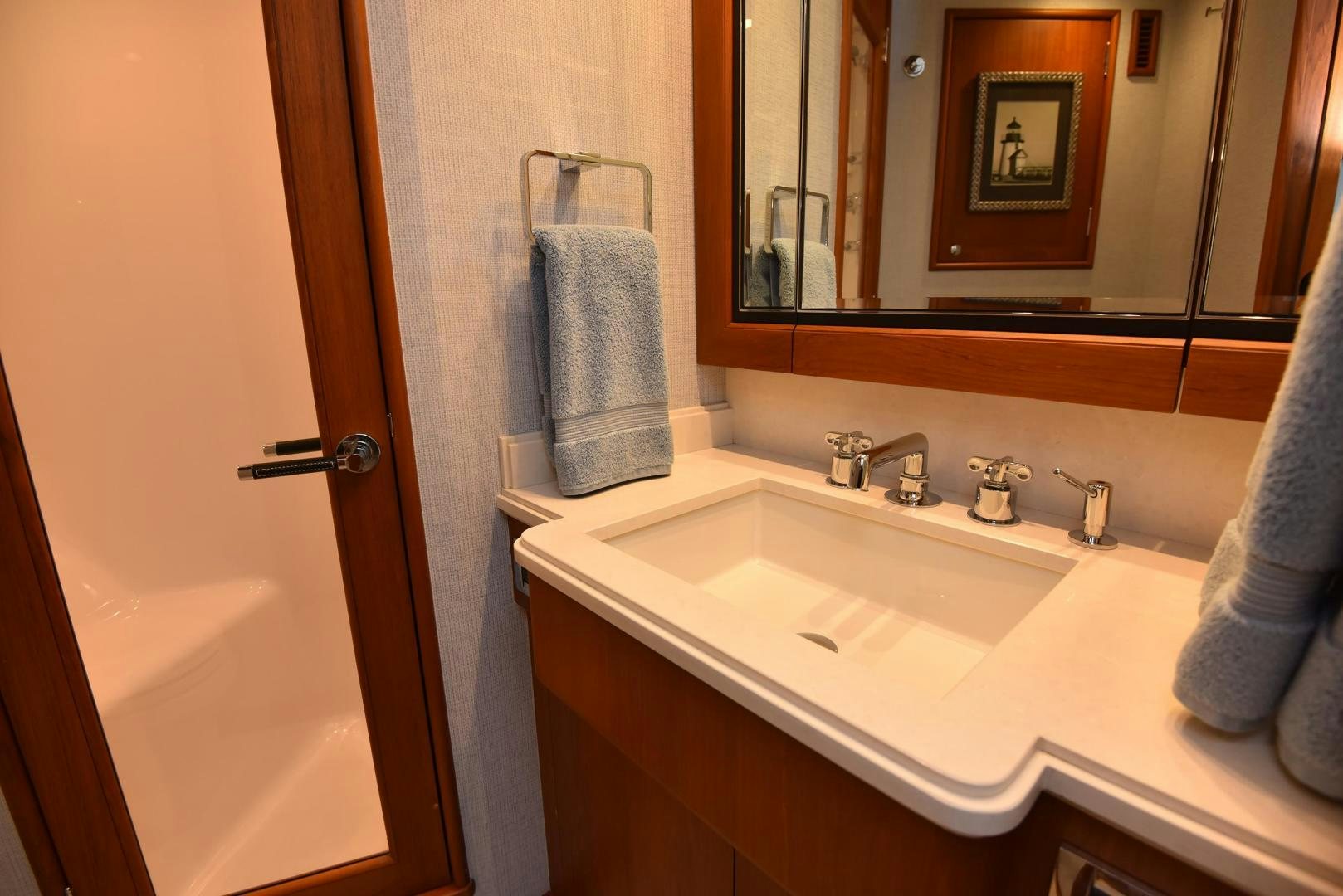 a bathroom with a mirror and a sink aboard MY LYNN Yacht for Sale