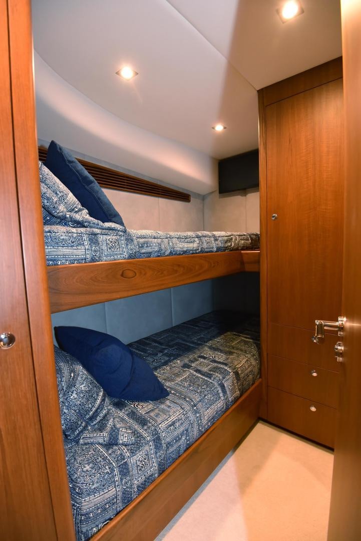 a bedroom with a bed and a closet aboard MY LYNN Yacht for Sale