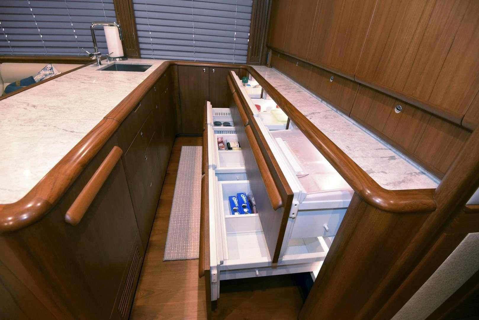 a wood table with a metal bar on it aboard MY LYNN Yacht for Sale