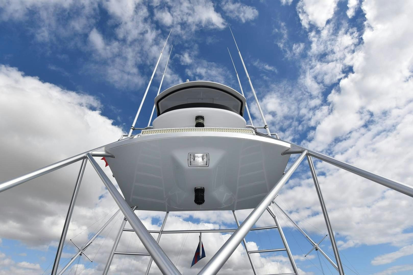 a white tower with a flag on it aboard MY LYNN Yacht for Sale
