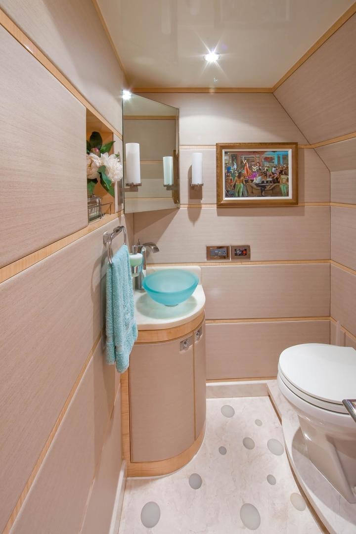 a bathroom with a sink and toilet aboard INCEPTION Yacht for Sale