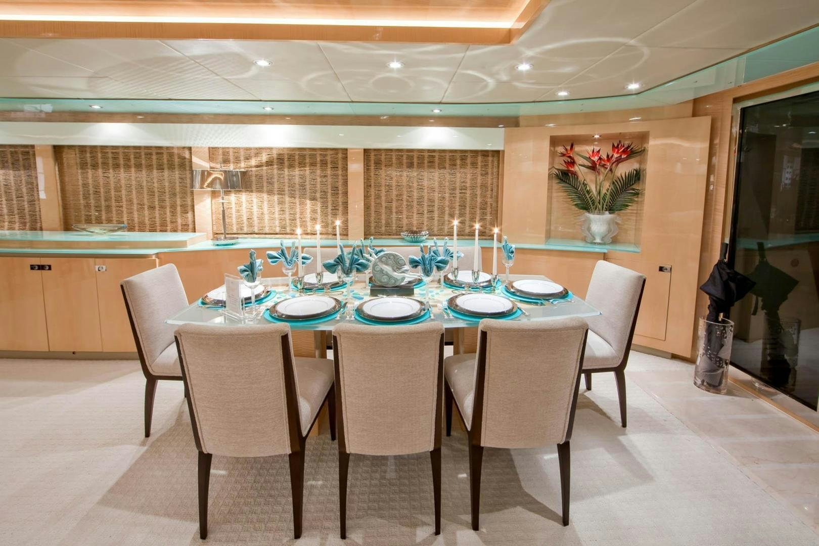 a table set for a dinner party aboard INCEPTION Yacht for Sale