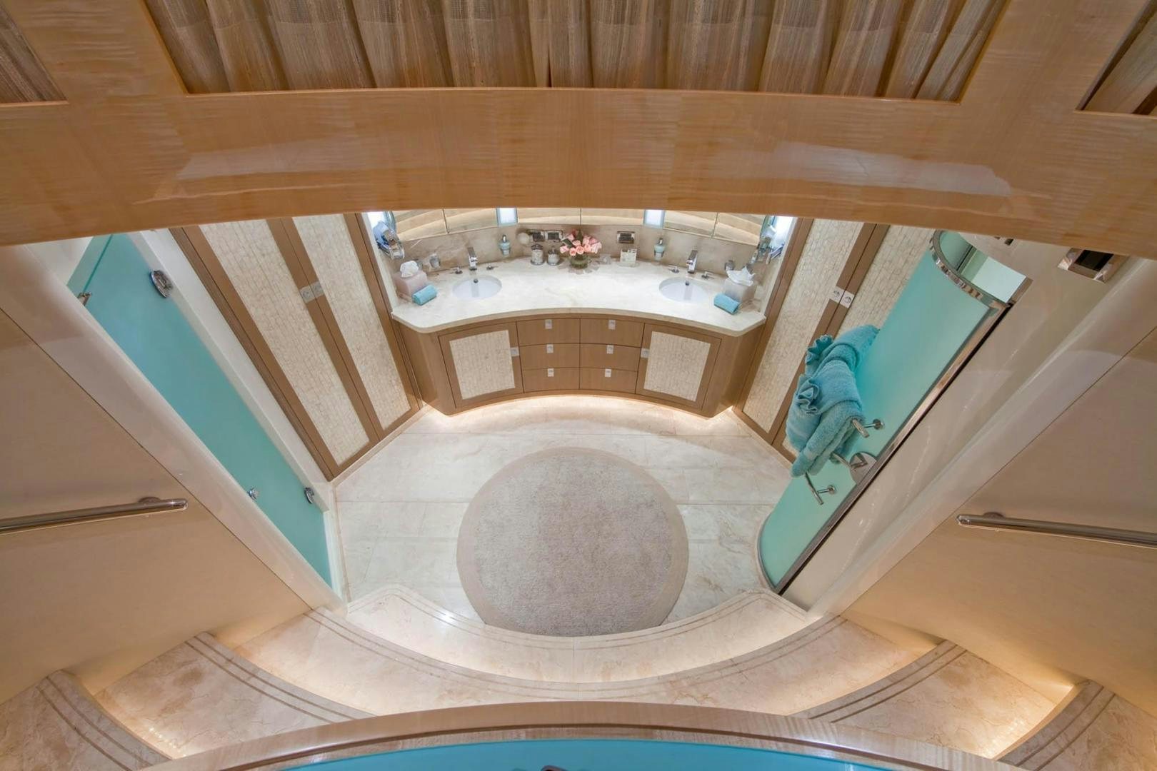 a bathroom with a tub and a sink aboard INCEPTION Yacht for Sale