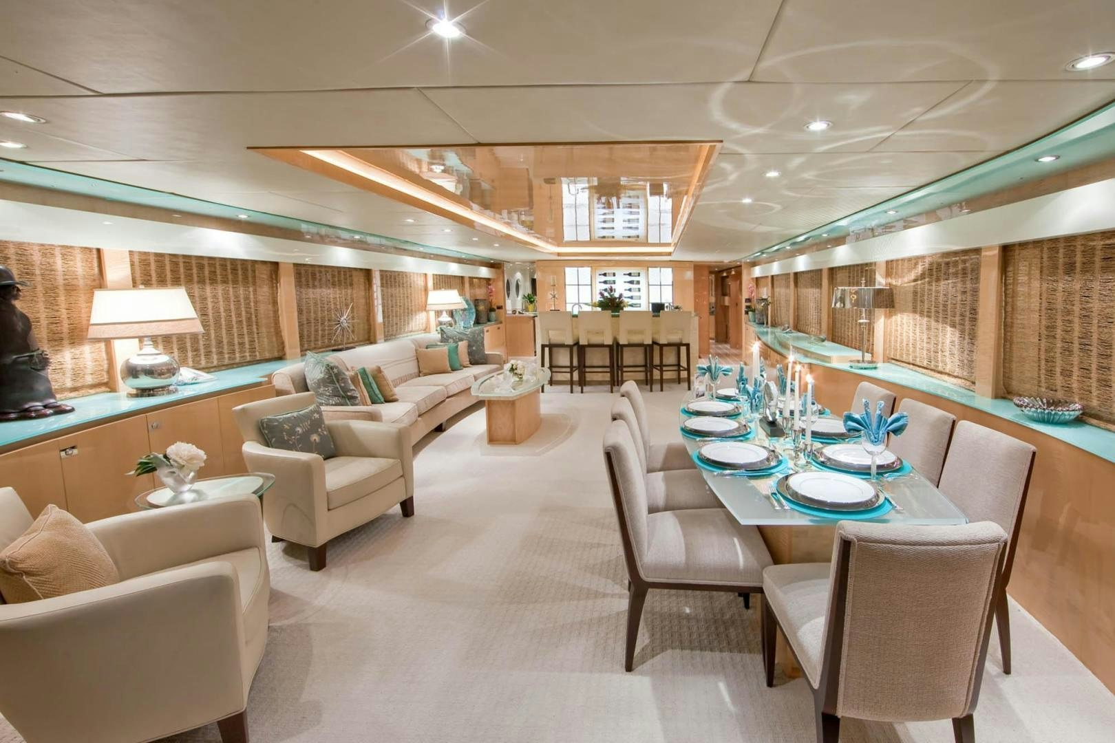 a large room with a table and chairs aboard INCEPTION Yacht for Sale