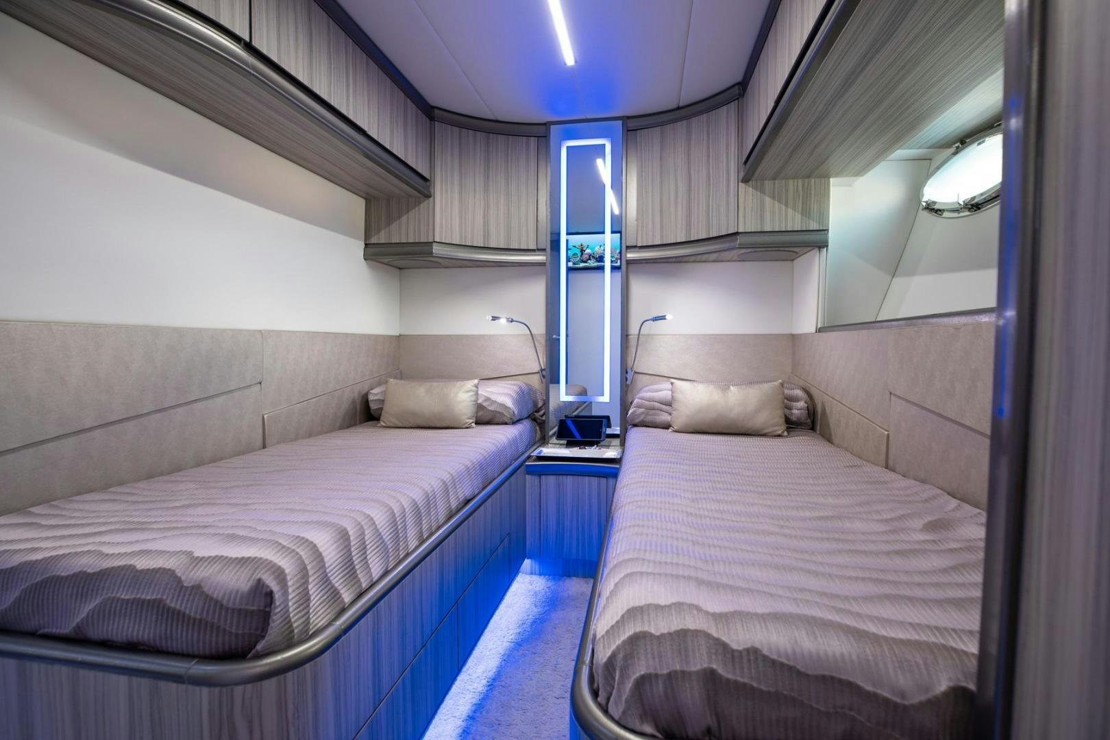 a couple of beds in a room aboard AMORA Yacht for Sale