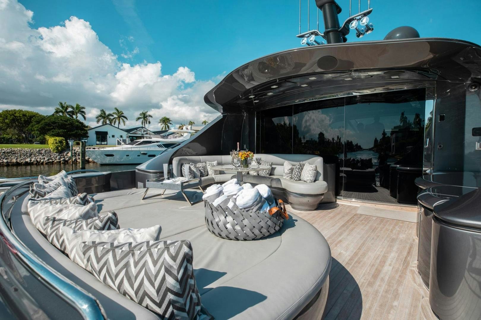 a large white table with chairs and a fireplace aboard AMORA Yacht for Sale