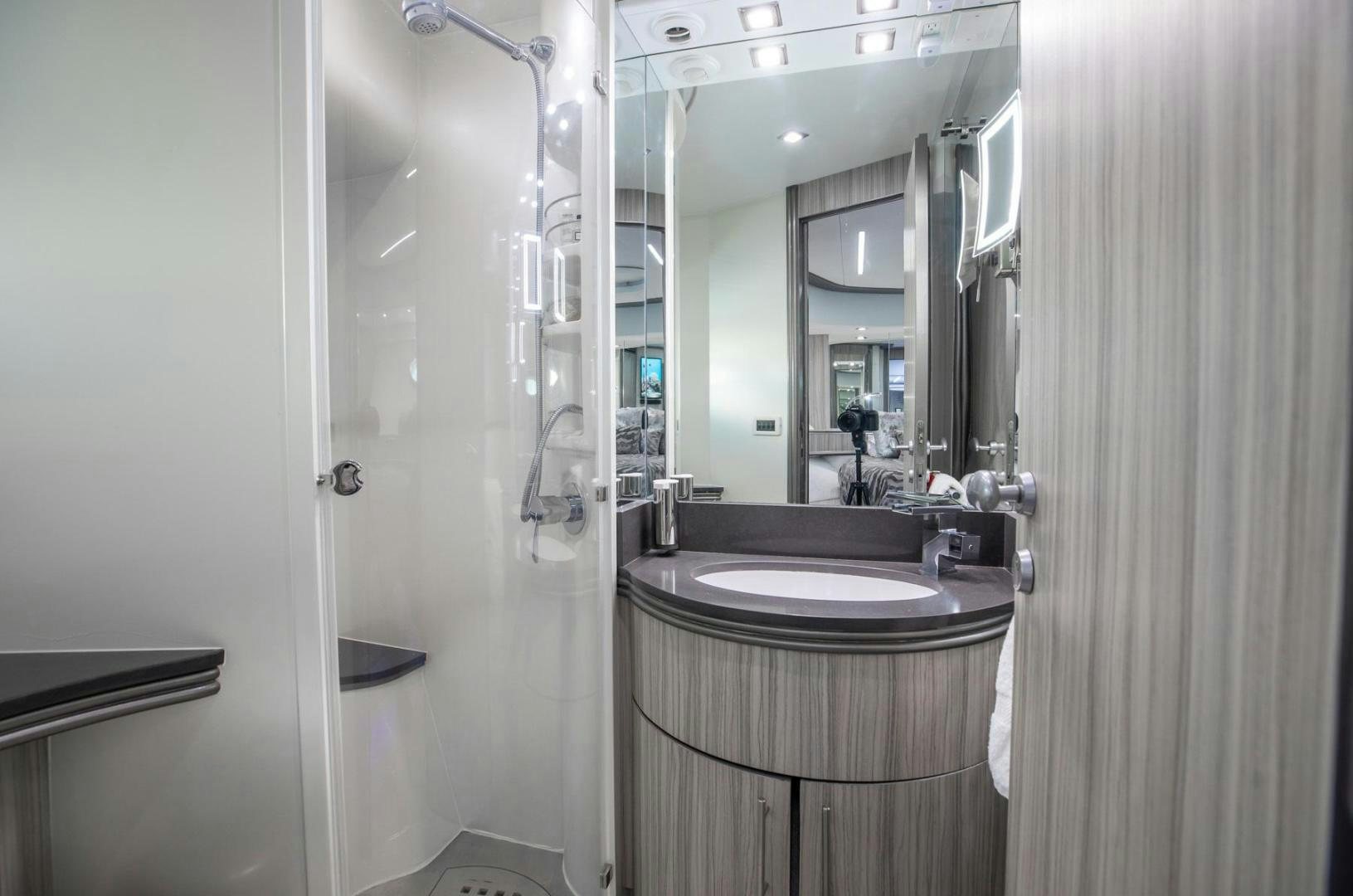 a bathroom with a stand up shower aboard AMORA Yacht for Sale