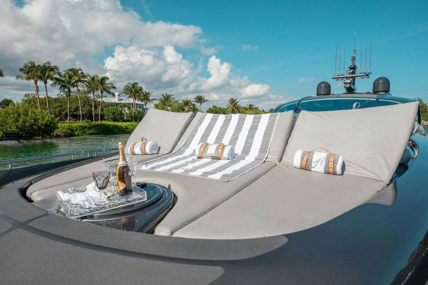 a white boat on a beach aboard AMORA Yacht for Sale