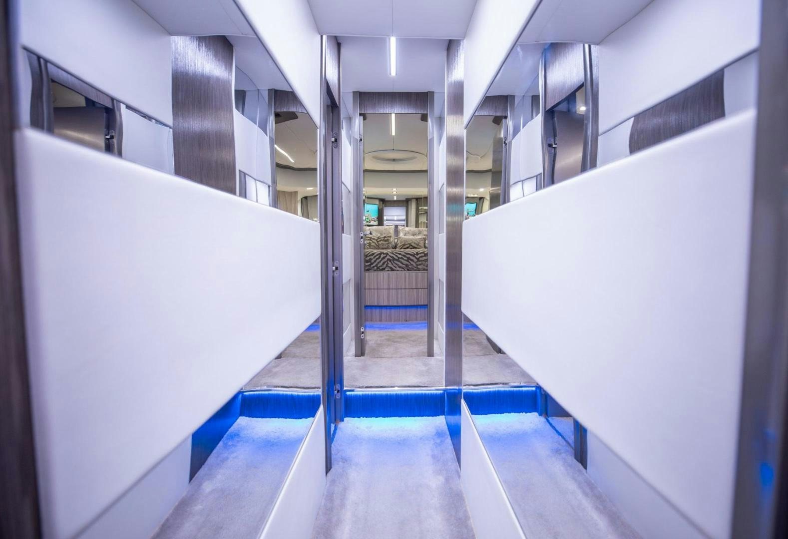 a long hallway with blue and white tiles aboard AMORA Yacht for Sale