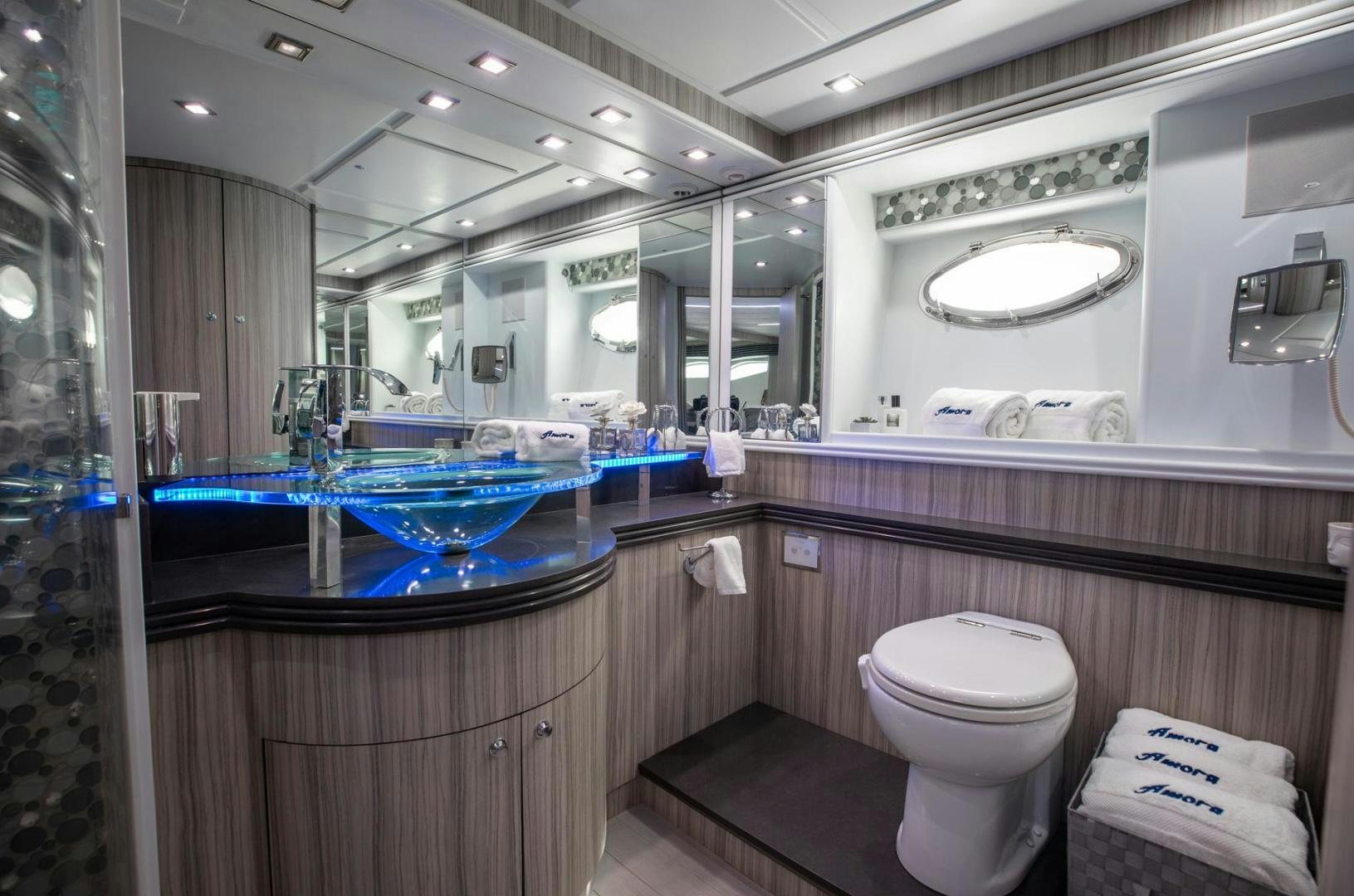 a bathroom with a large mirror aboard AMORA Yacht for Sale