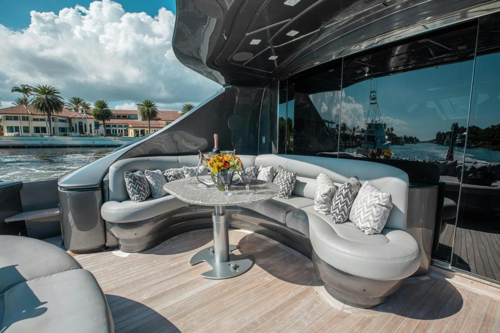 a couch with a table on it aboard AMORA Yacht for Sale