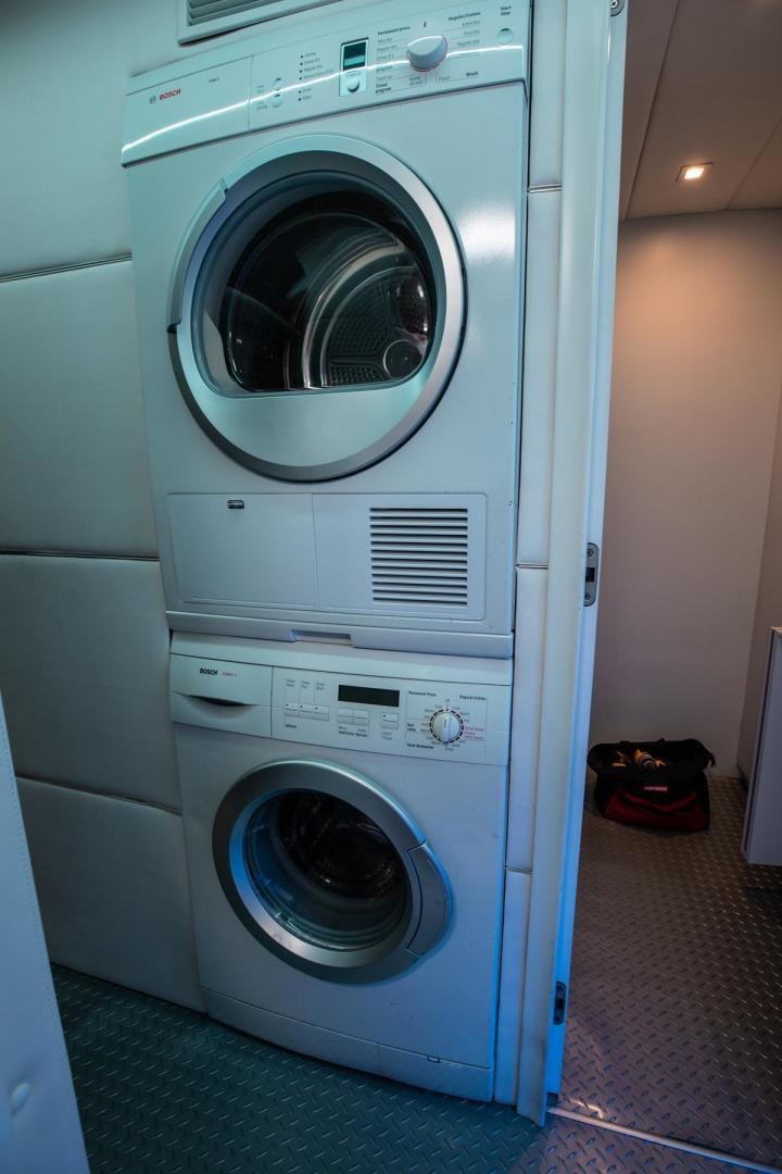 a white washing machine aboard AMORA Yacht for Sale