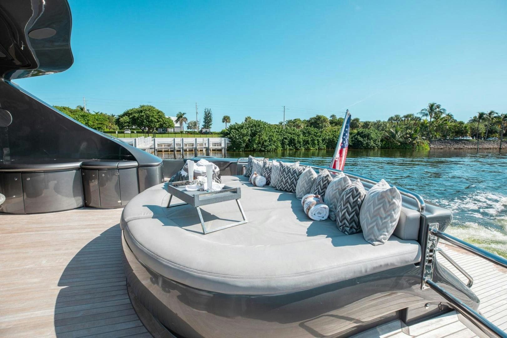 a boat with a flag on it aboard AMORA Yacht for Sale