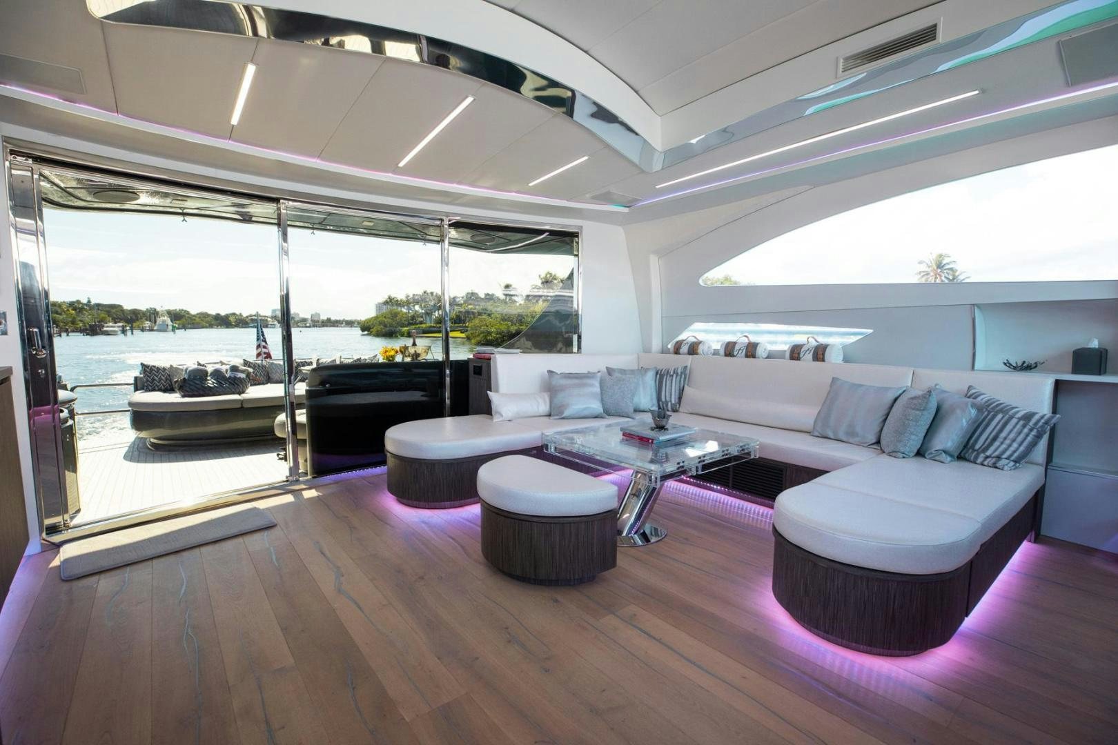 a living room with a large window aboard AMORA Yacht for Sale