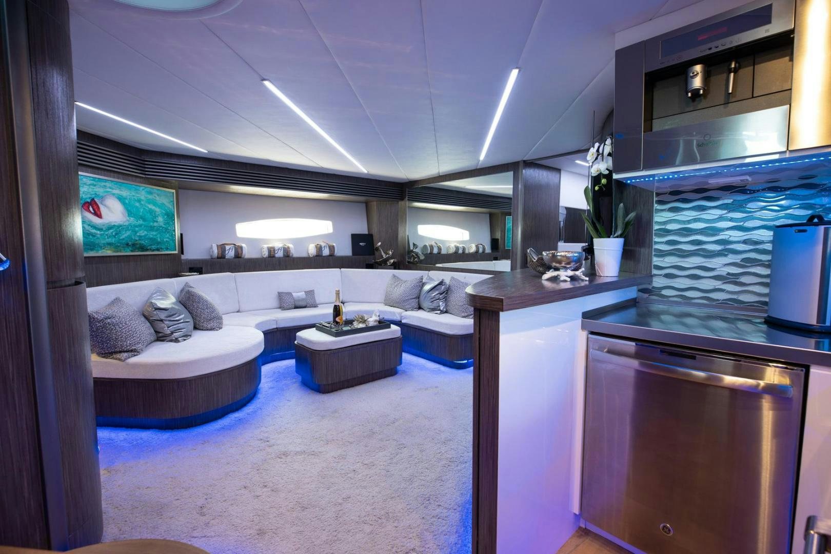 a room with a bed and a table aboard AMORA Yacht for Sale