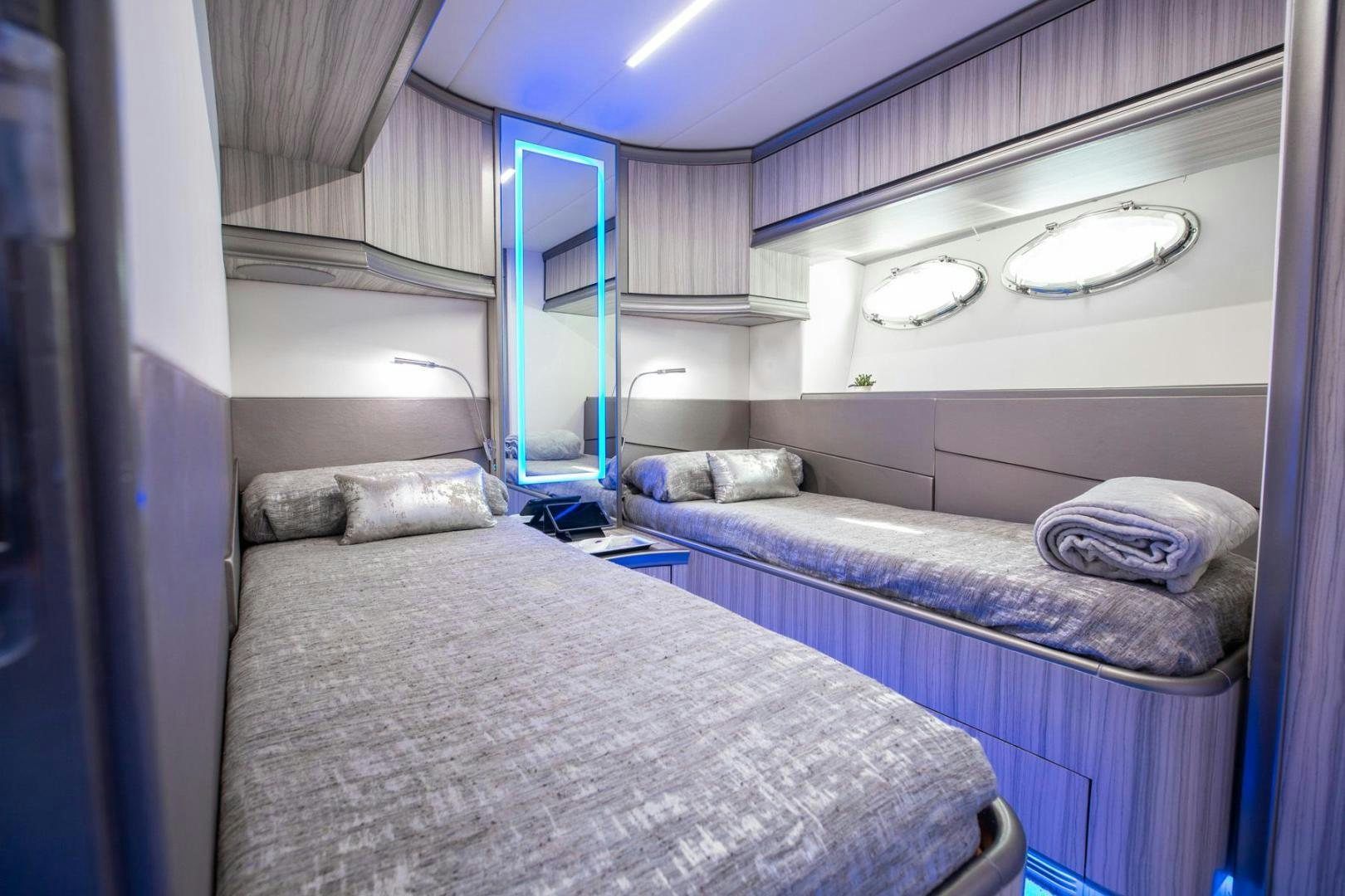 a room with two beds aboard AMORA Yacht for Sale