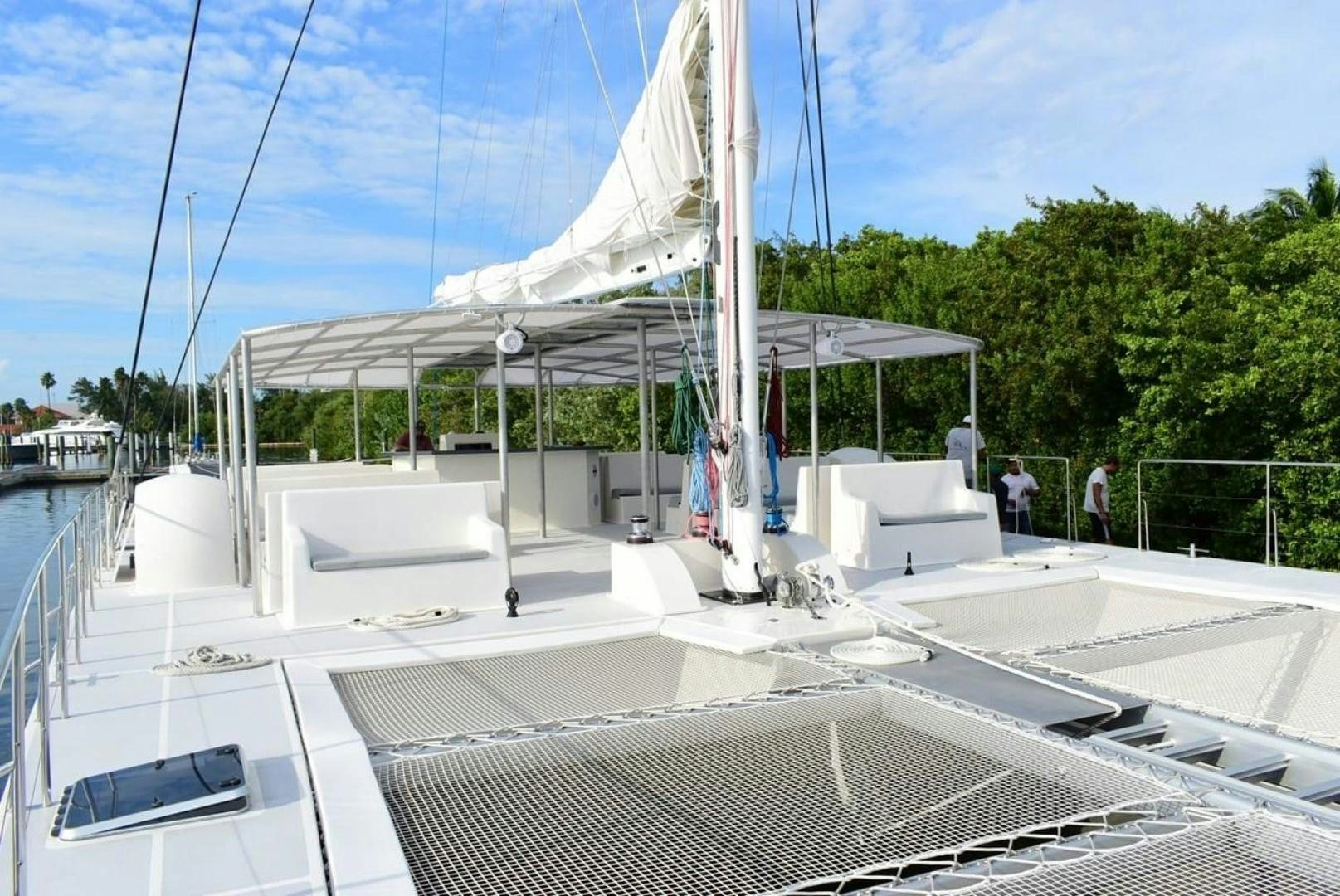 a white boat on a dock aboard COMPASS Yacht for Sale
