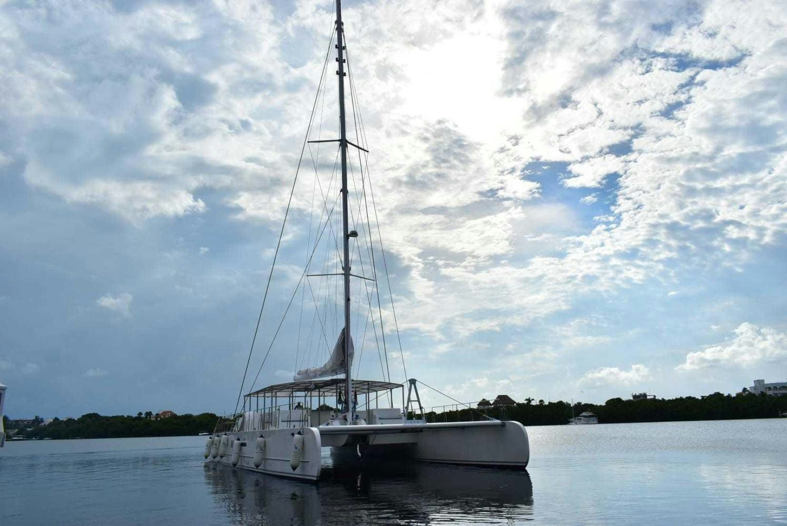 a sailboat on the water aboard COMPASS Yacht for Sale