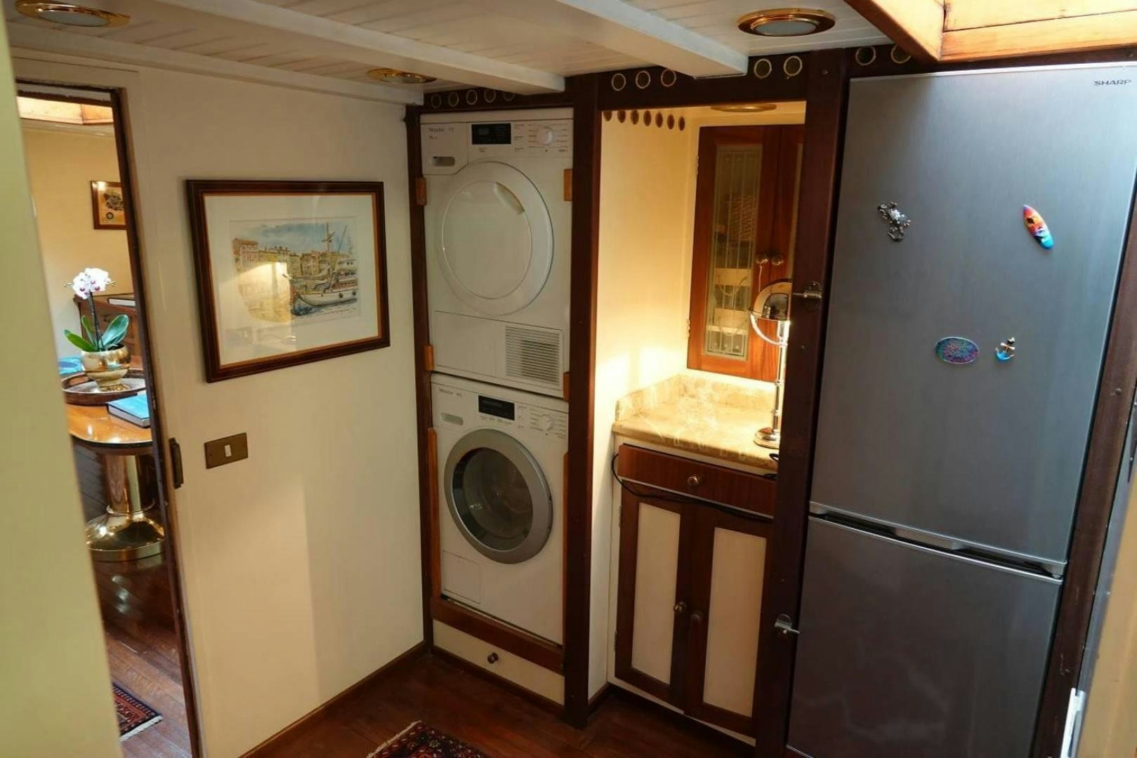 a washer and dryer in a room aboard TAMORY Yacht for Sale