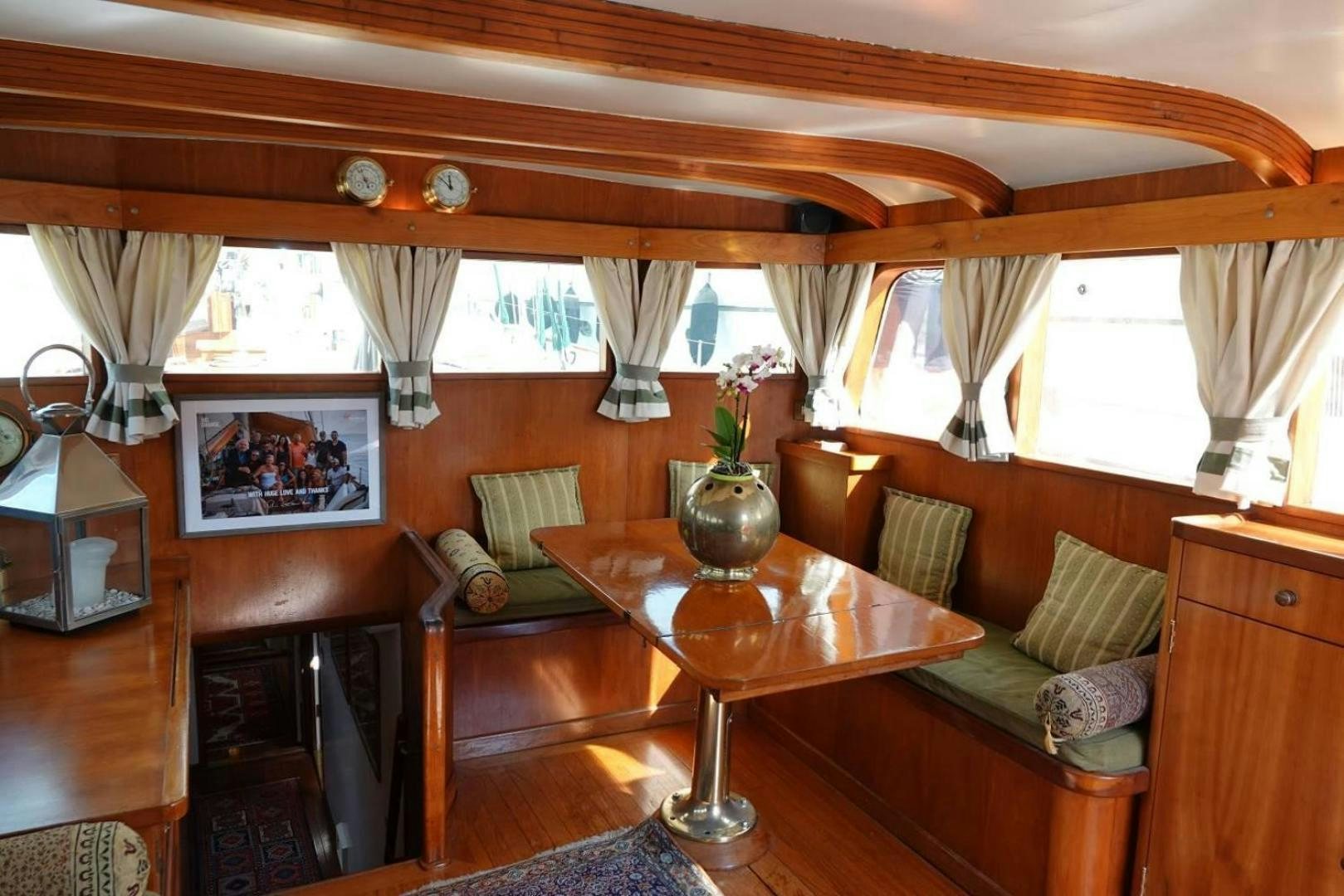a living room with a couch and a table aboard TAMORY Yacht for Sale