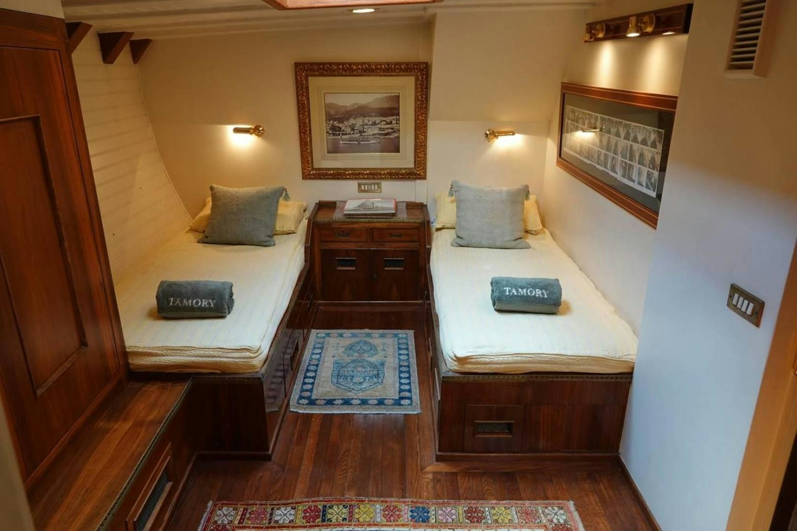 a hotel room with a bed and desk aboard TAMORY Yacht for Sale