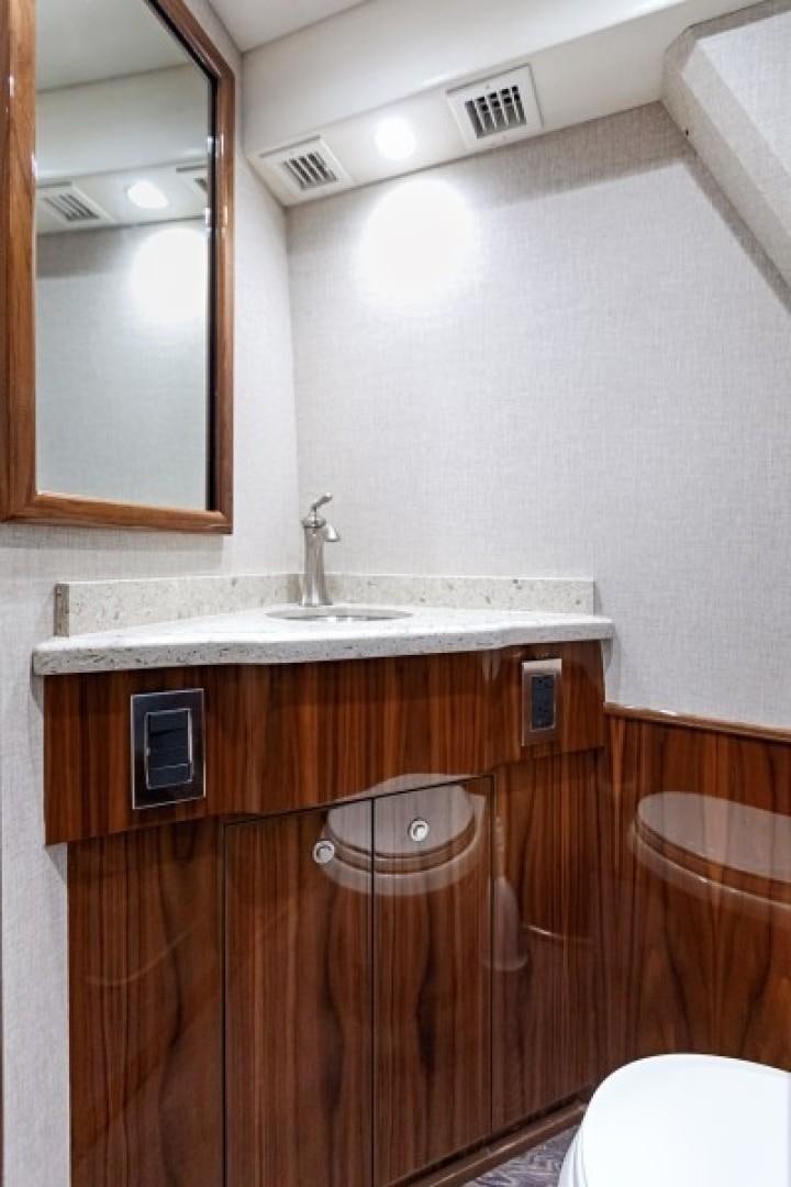 a bathroom with a sink and a mirror aboard REEL GOOD TIME Yacht for Sale