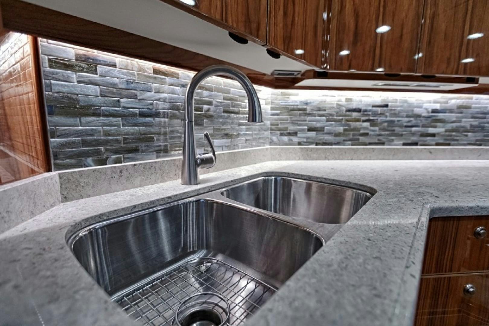 a kitchen with a stainless steel sink aboard REEL GOOD TIME Yacht for Sale