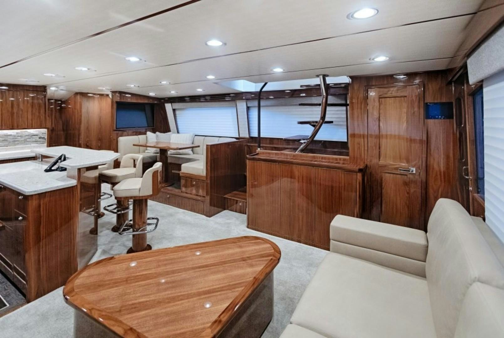 a room with a table and chairs aboard REEL GOOD TIME Yacht for Sale