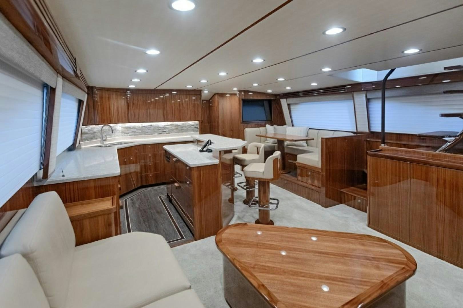 a room with a table and chairs aboard REEL GOOD TIME Yacht for Sale