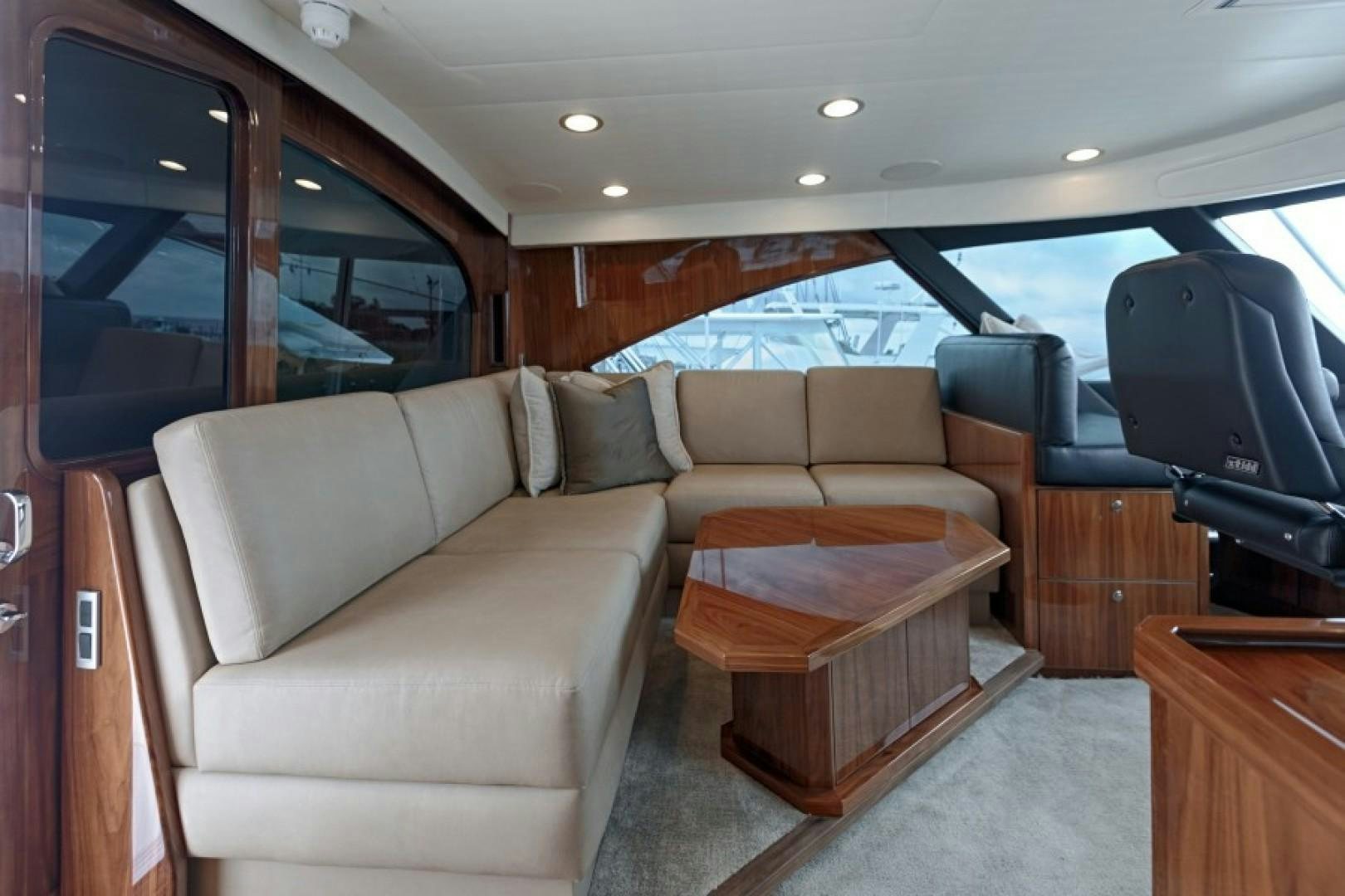 a living room with a couch and a tv aboard REEL GOOD TIME Yacht for Sale