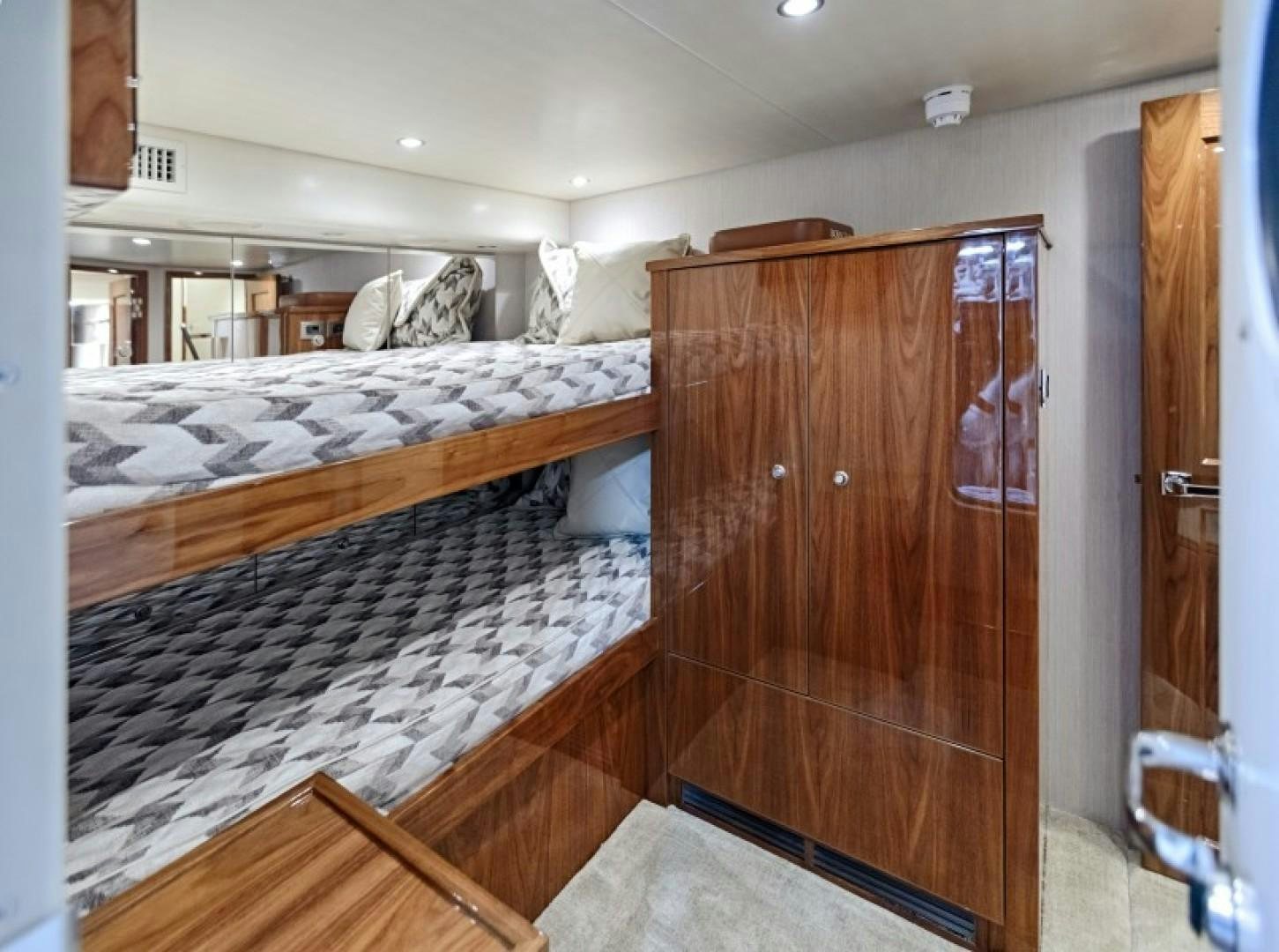 a bedroom with a wood door aboard REEL GOOD TIME Yacht for Sale