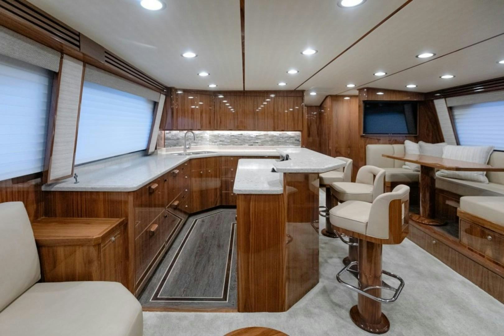 a room with a table and chairs aboard REEL GOOD TIME Yacht for Sale