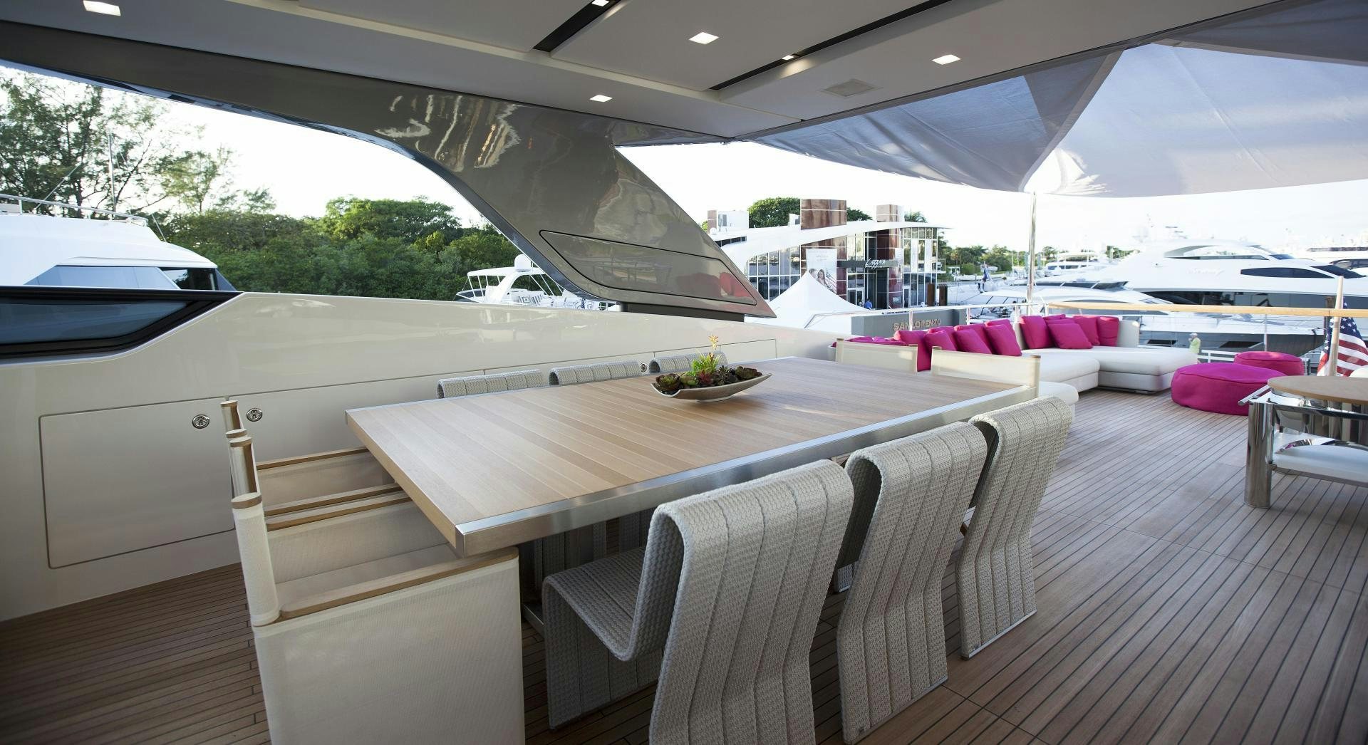 a table with chairs around it aboard BODACIOUS Yacht for Sale