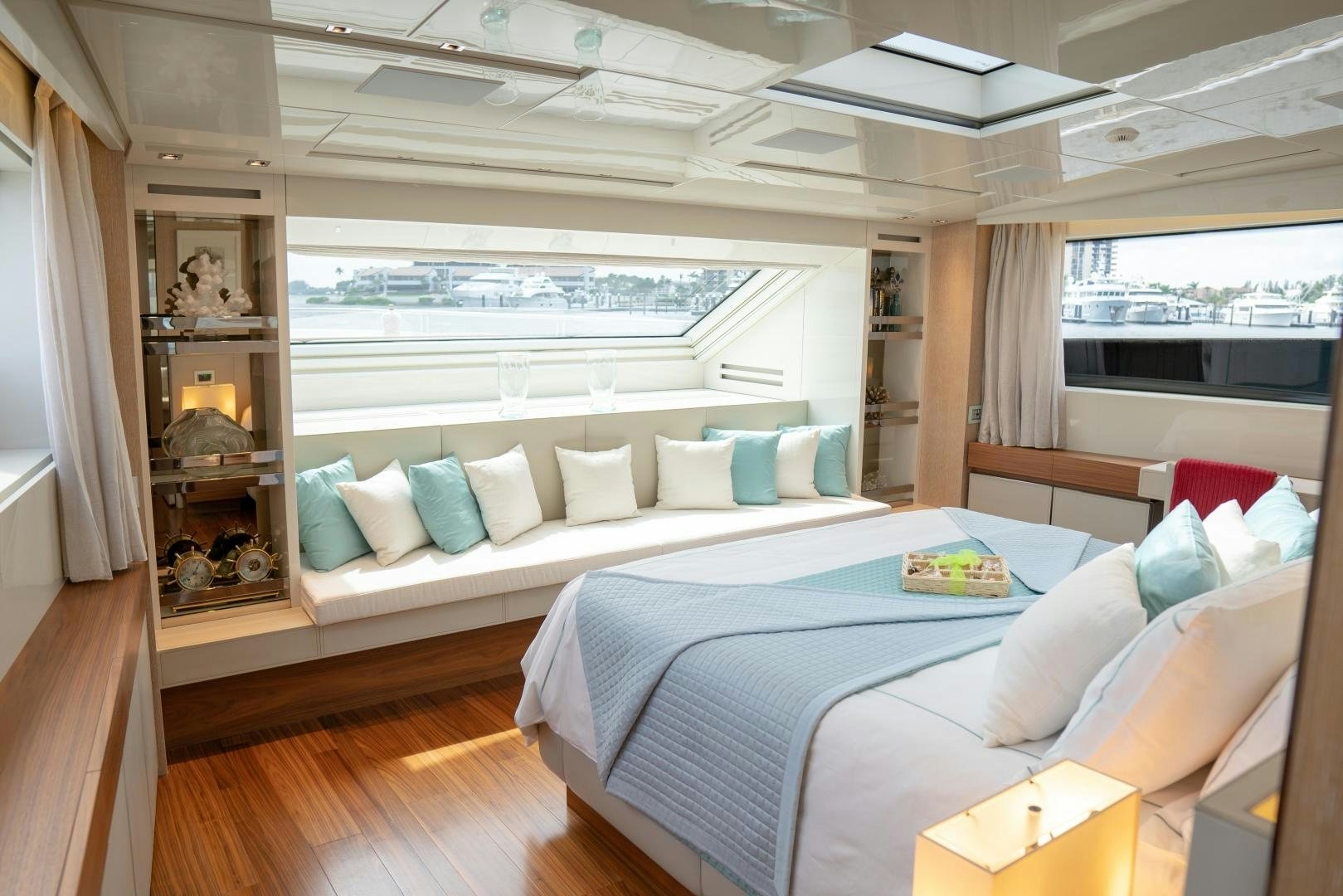 a room with a bed and a couch aboard BODACIOUS Yacht for Sale