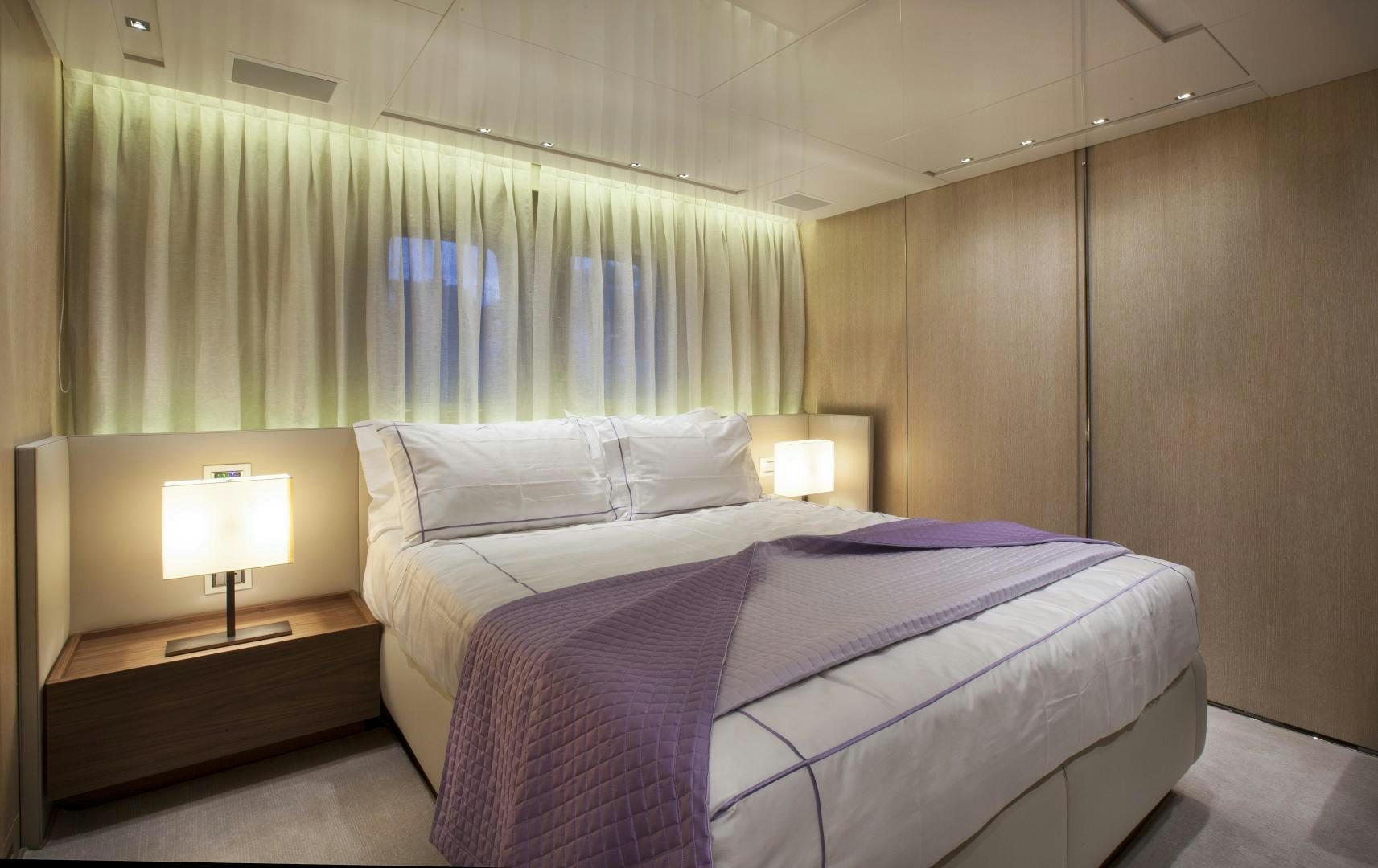 a couple of beds in a hotel room aboard BODACIOUS Yacht for Sale