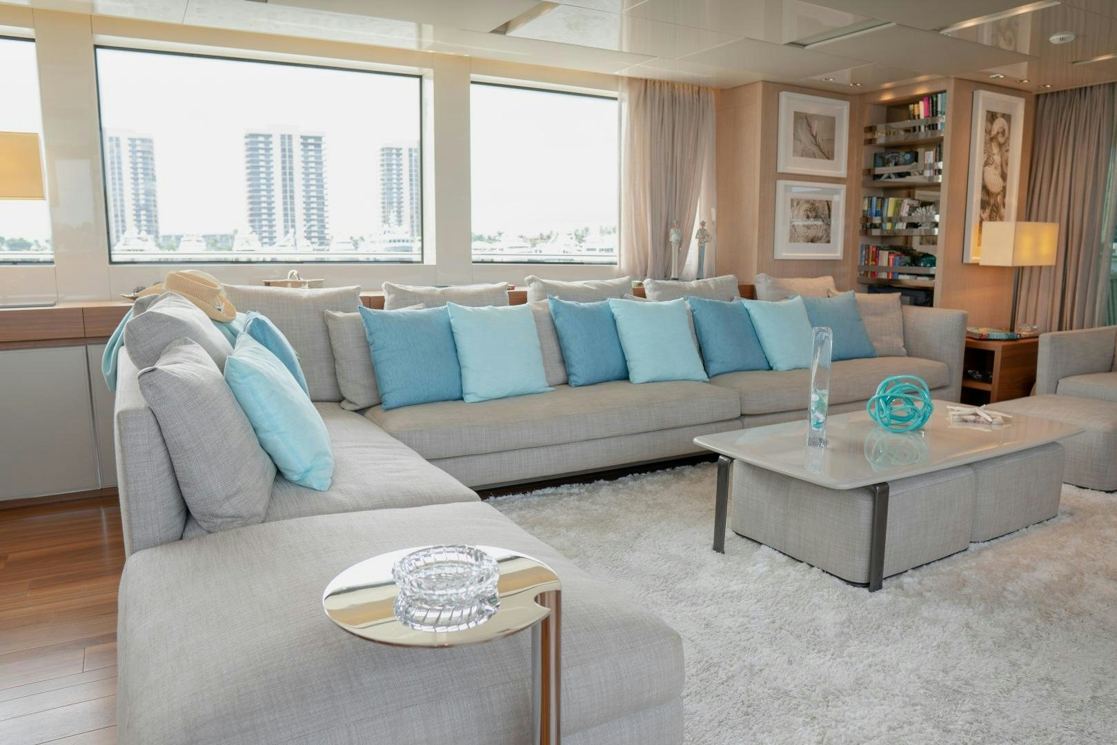 a living room with a couch and a coffee table aboard BODACIOUS Yacht for Sale