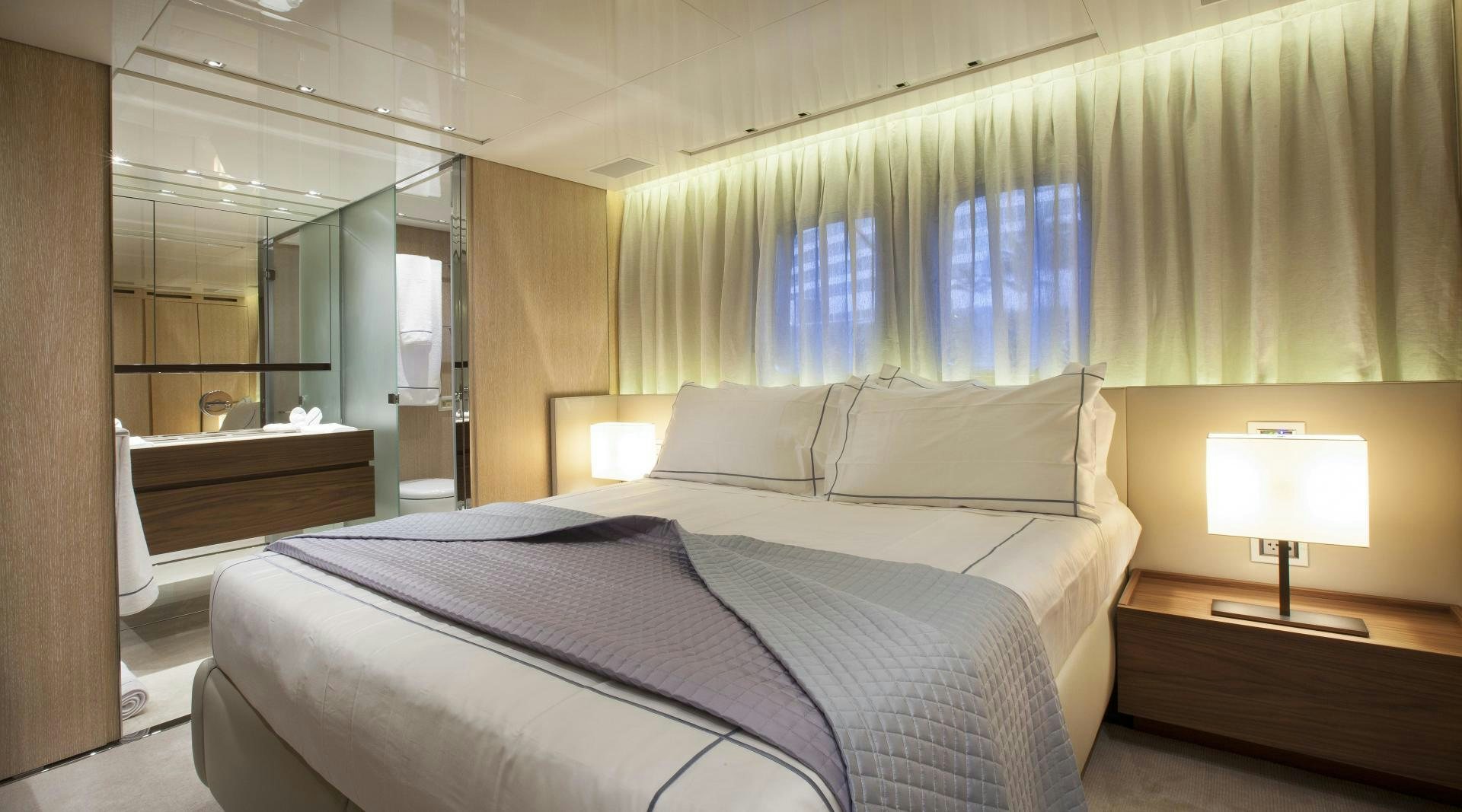 a bed in a hotel room aboard BODACIOUS Yacht for Sale