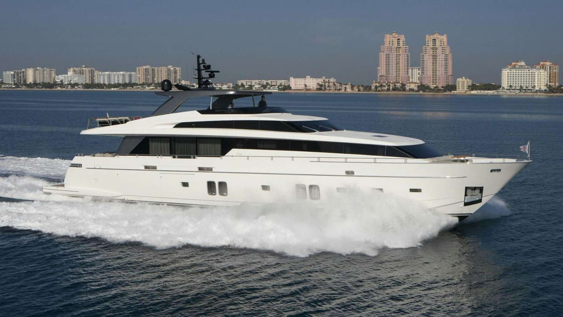 a white yacht on the water aboard BODACIOUS Yacht for Sale
