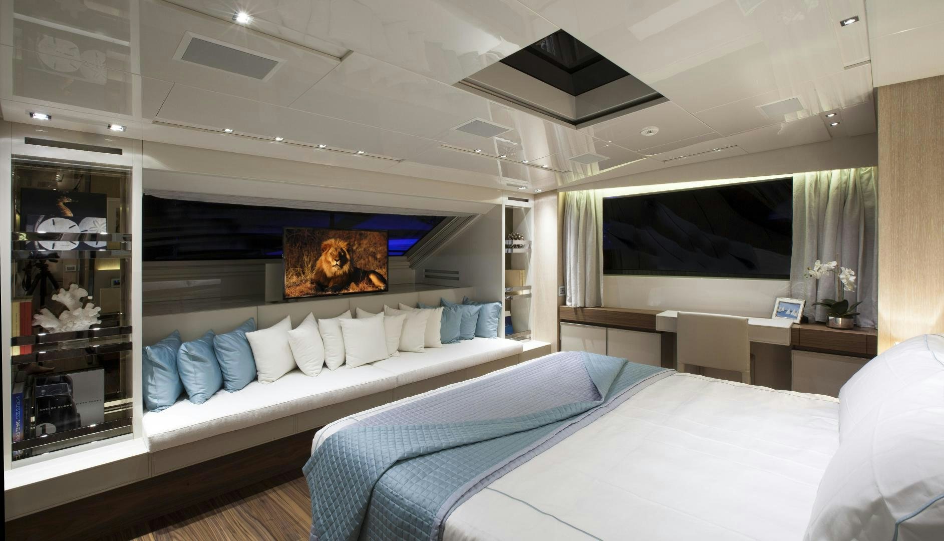 a room with a bed and a television aboard BODACIOUS Yacht for Sale