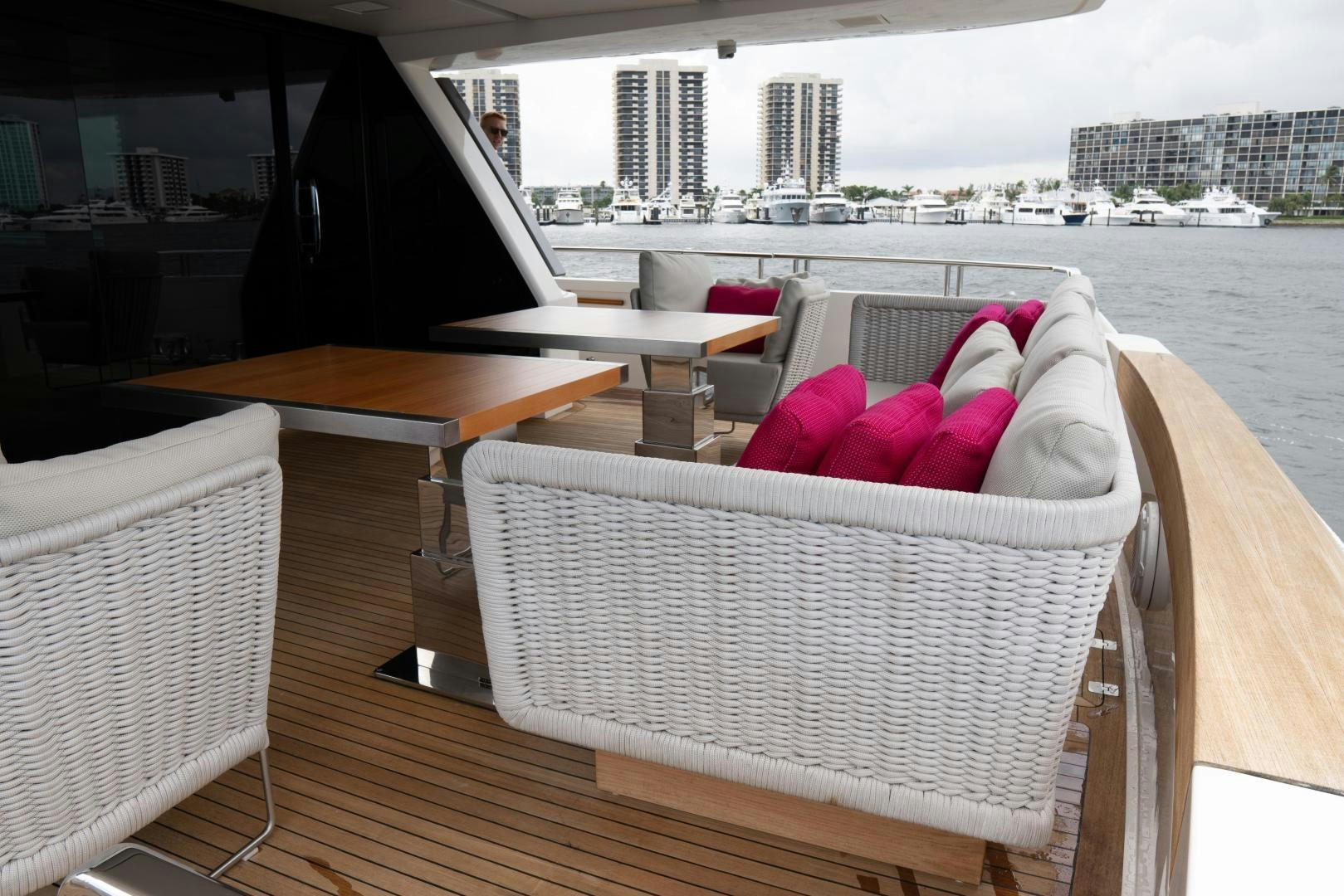 a table and chairs on a balcony aboard BODACIOUS Yacht for Sale