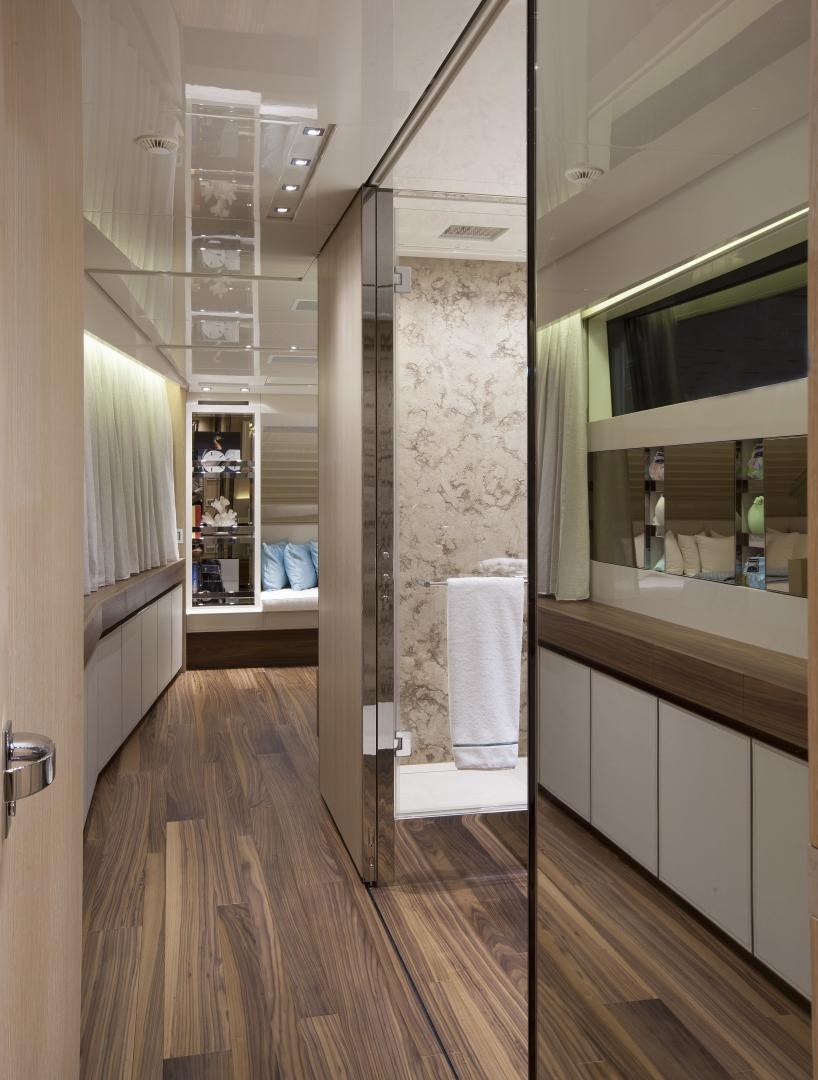 a bathroom with a glass shower aboard BODACIOUS Yacht for Sale