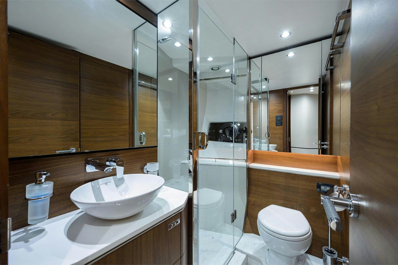 a bathroom with a glass shower aboard GREAT NEWS Yacht for Sale