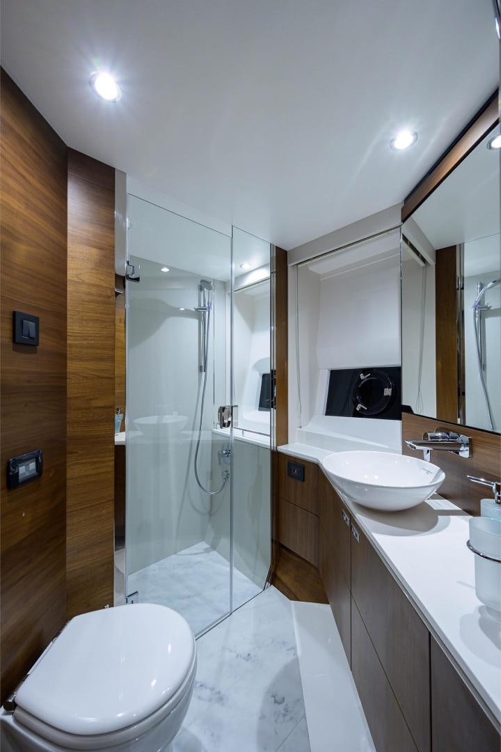 a bathroom with a glass shower aboard GREAT NEWS Yacht for Sale