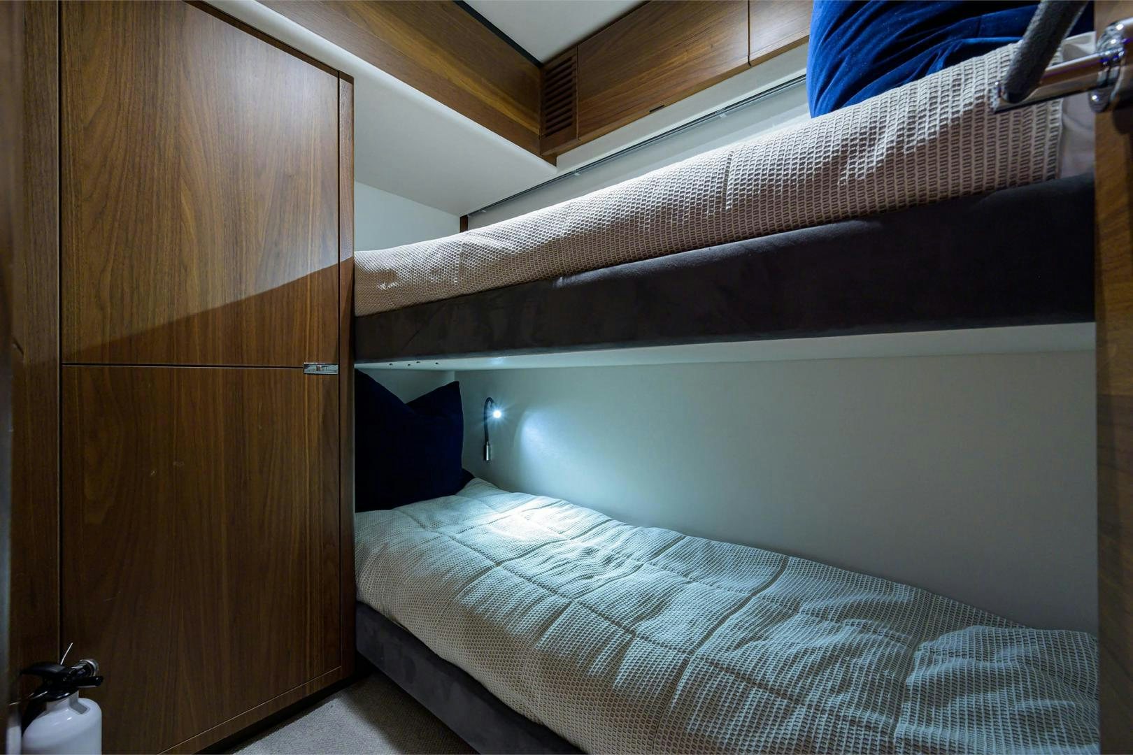 a bed with a wooden headboard aboard GREAT NEWS Yacht for Sale
